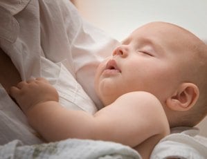 sleeping-baby-mother-lap-min